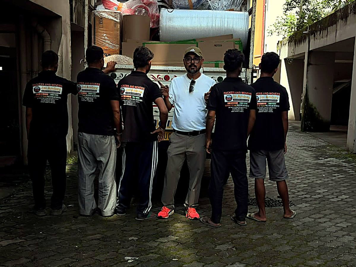 Our founder with the Jai Ambay crew at the loaded truck, Guwahati.