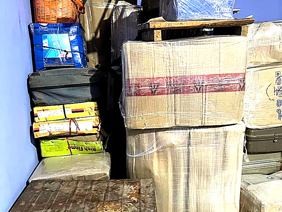 Home shifting, Shillong → Guwahati — loading household goods onto our truck.